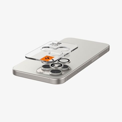 AGL07163 - iPhone 15 Pro / 15 Pro Max Optik Pro Lens Protector in natural titanium showing the device